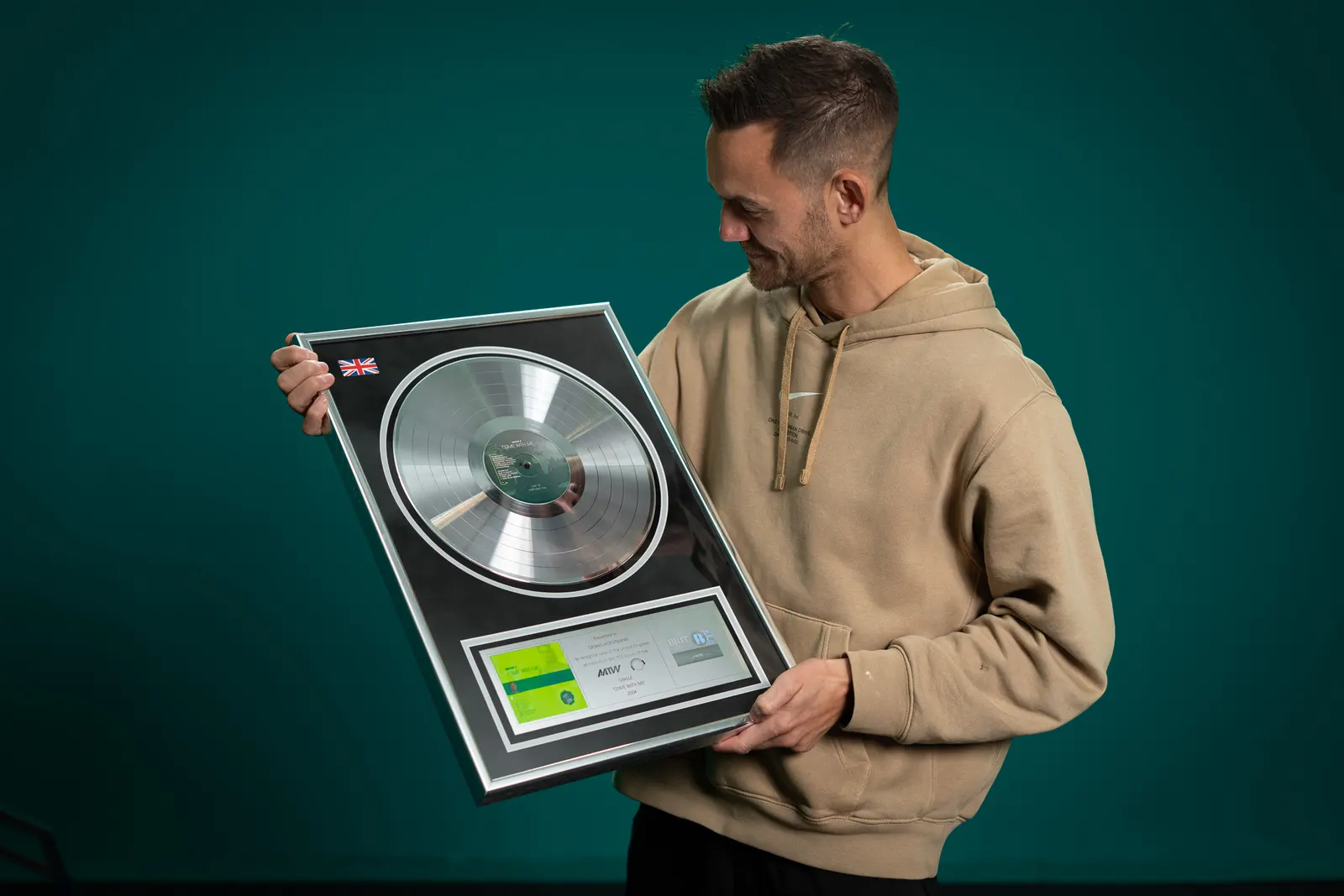 Special D. holding a record award