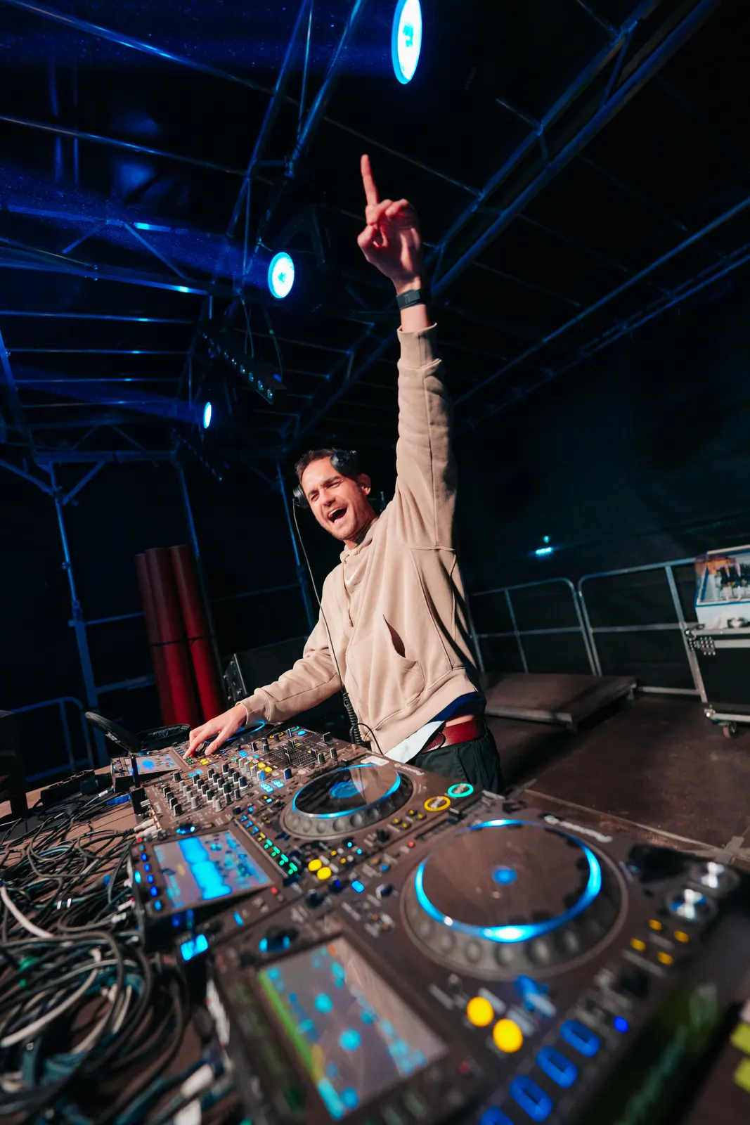 Special D. on the mainstage, arm raised behind the decks